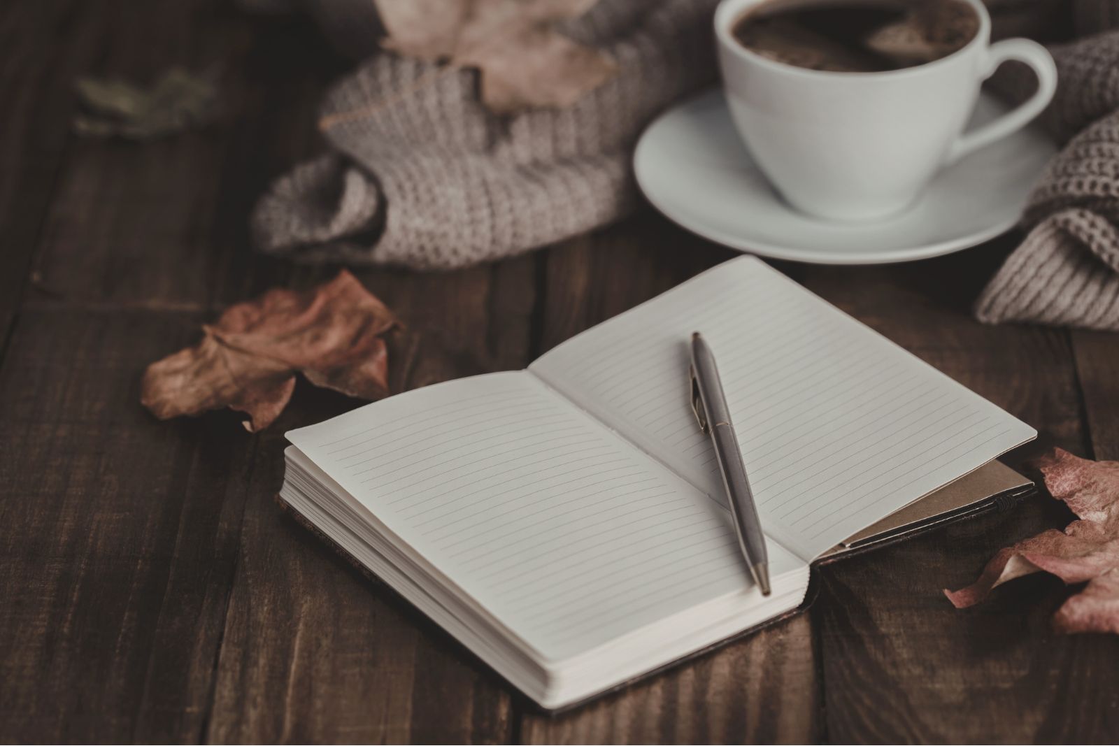 Journaling with a notebook and pen for mental health reflection