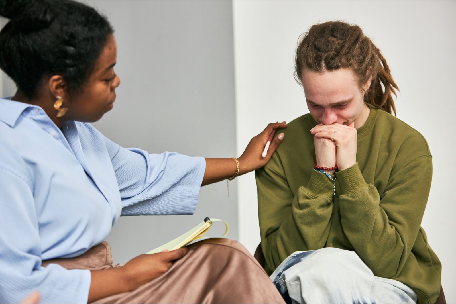 Counselor providing supportive conversation in an office