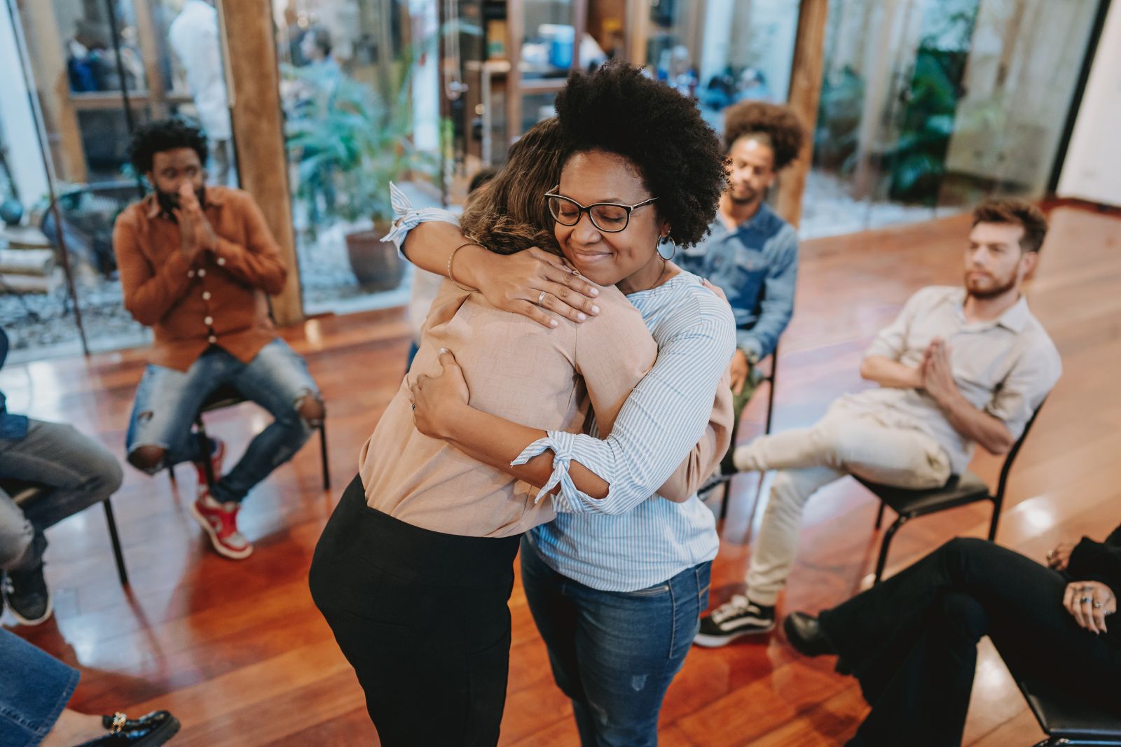 Supportive family conversation in a living room about recovery