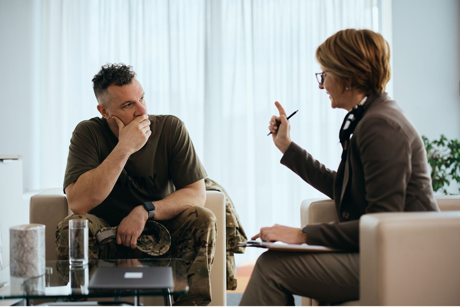 Adult and healthcare professional talking in a private office